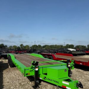 Front angled view of a green Load Trail 102 in x 26 ft car trailer with wood deck and triple axles
